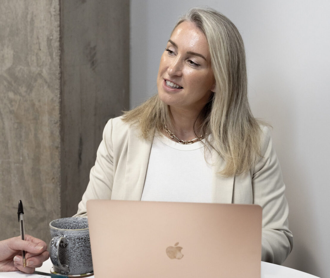 individual clinician portrait at a laptop